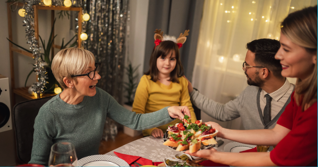 Family during the holidays enjoying a meal while using better communication from Jody Sargent, LCSW's tips. 
