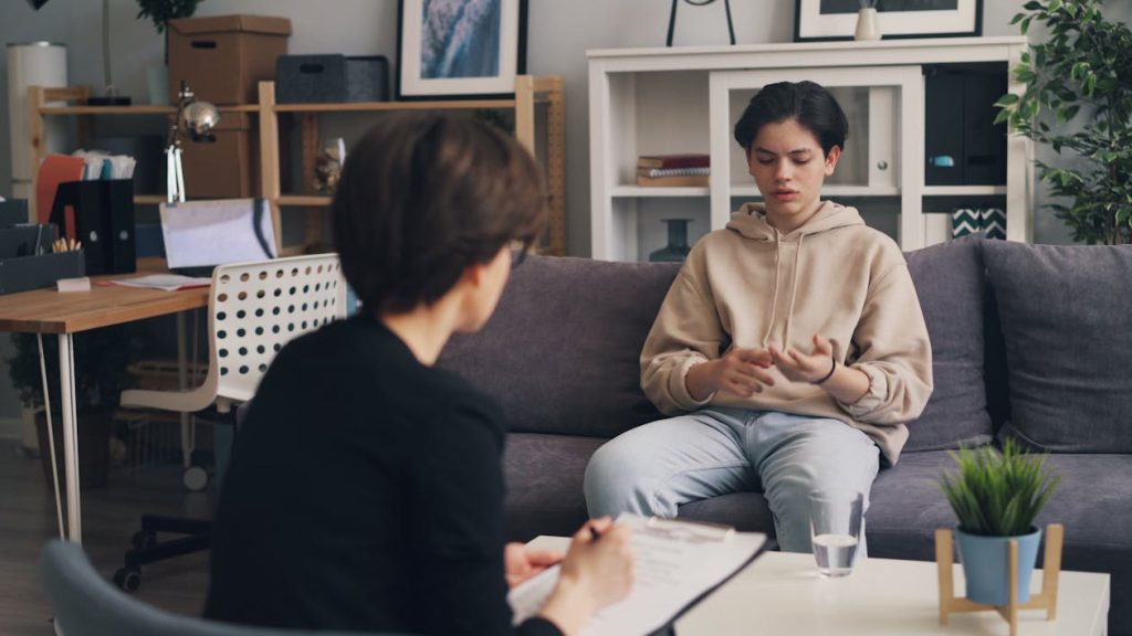 Therapist guiding teen through strategies for positive self-talk for teens